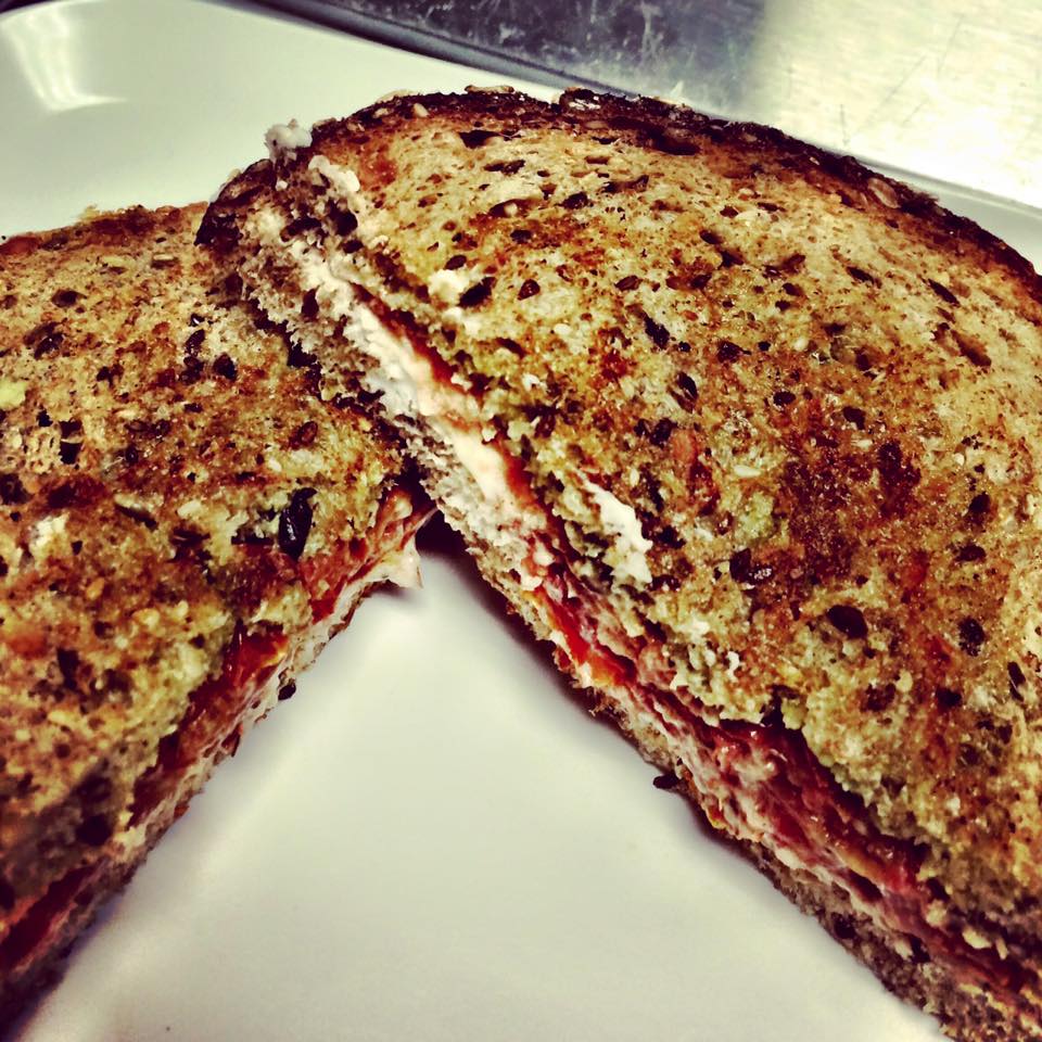 Zume's Grilled Goat Cheese Roasted Tomato with housemade pesto